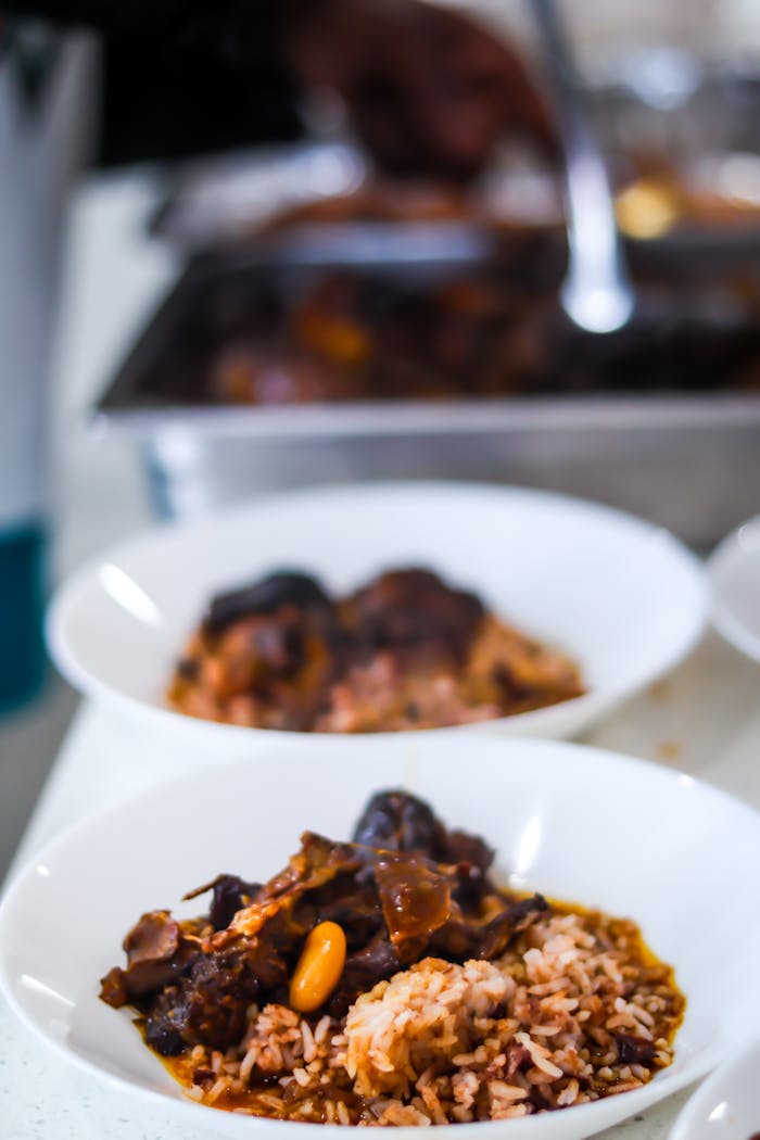 Tantalizing Caribbean oxtail served with rice and peas, showcasing authentic West Indian flavors.